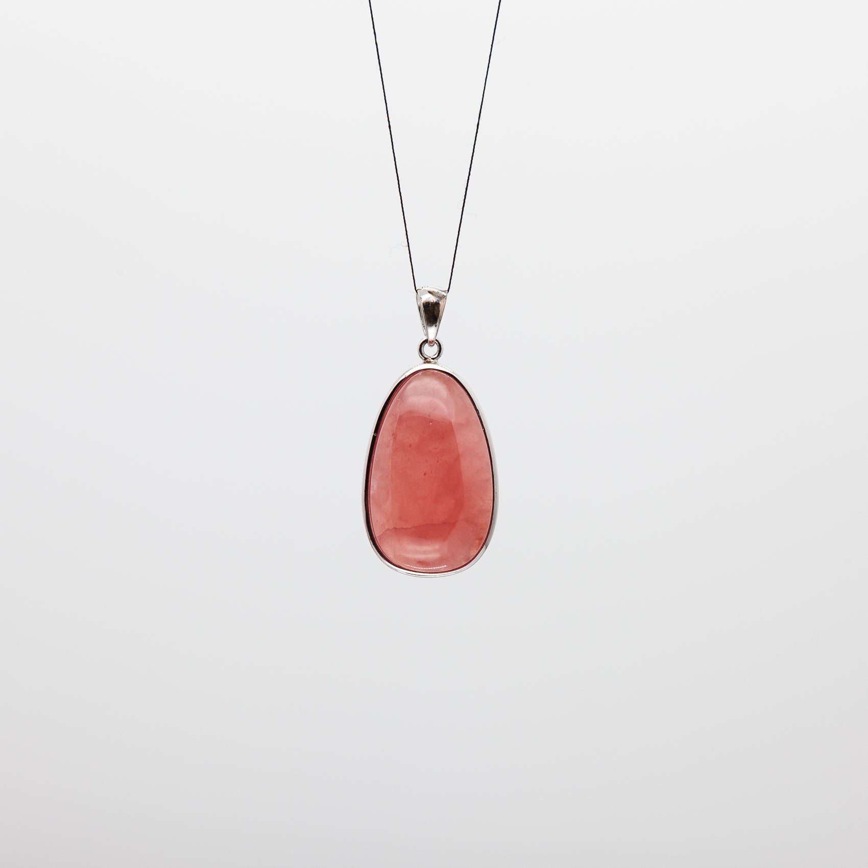 Drop Shape Rhodochrosite Pendant: A Touch of Blushing Elegance